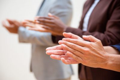 Hands of business people applauding speaker. Business group appreciating seminar, training or conference. Successful seminar concept